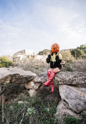 Wallpaper Mural Halloween Pumpkin Head Girl in Urban Graffiti Scene with a red balloon. Torontodigital.ca