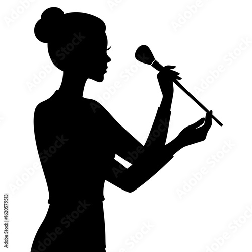 Woman applying makeup silhouette brush application
