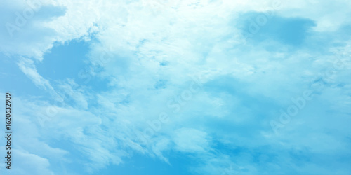 Cloudy blue summer storm  in the sky, watercolor background, horizontal view, beautiful cloudscape, fresh air, nature shining light, sunrise sky, panoramic view, daylight, vast fluffy tiny white sunsh