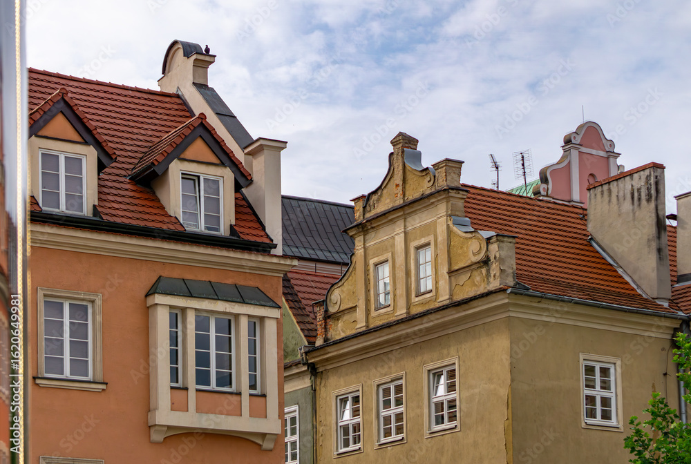 Fototapeta premium Colorful historic townhouses with red roofs in the Old Town of Poznań, Poland.