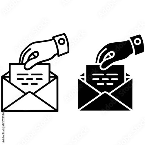 Hand placing letter into open envelope set