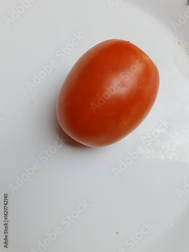 red tomato on a white background