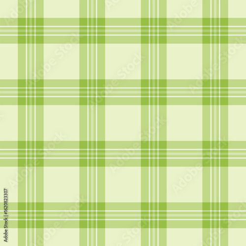 Seamless plaid pattern in shades of green and white. Versatile background for textiles, wrapping paper, or web design. Adds a fresh, modern touch to any project.