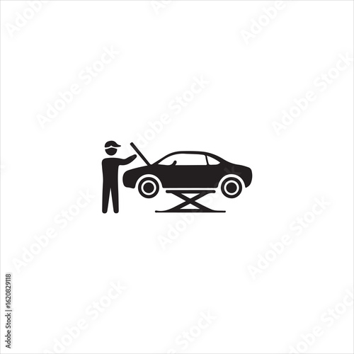 Black silhouette of a mechanic working on a car on a lift repair service