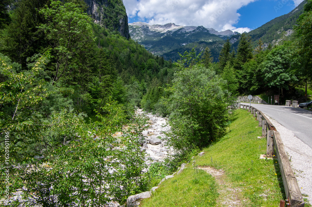 Fototapeta premium Amazing views of Trenta Valley Bovec Slovenia, long road with Soca river and high mountains, Triglav natioonal park Julian Alps