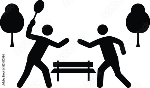 Two people playing badminton in a park with trees and a bench sport recreation