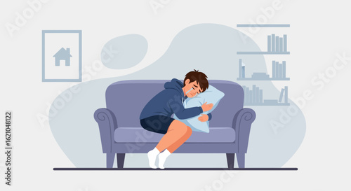 Upset Young Man Crying and Hugging a Pillow on a Purple Sofa