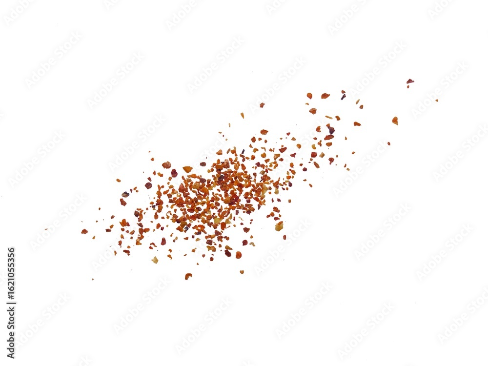 Obraz premium Spicy dried red chili pepper powder. Splashes of red pepper powder. A pile of crushed chilies or paprika. Splash effect from dried red chilies. Red dried chili pepper isolated on white background.