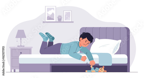 Sad boy trying to get his torn teddy bear from under the bed in his room