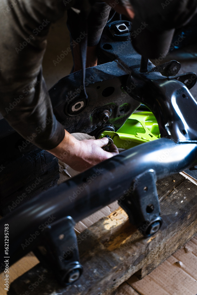 Fototapeta premium Drift Car Suspension Installation Process. Hands-on installation process of front suspension components for a drift car build, including coilovers, angle kit, and control arms.