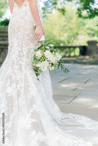 bride holding white bouquet