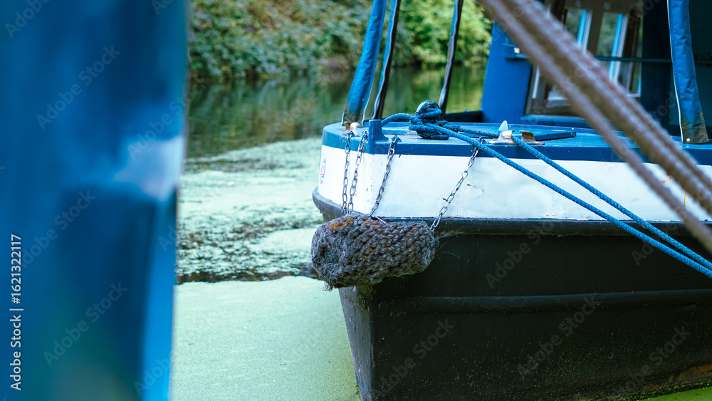 Obraz na plátně Vintage boats moored on calm canal water in charming English Little Venice town