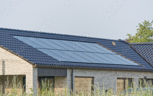 Wallpaper Mural New Beige Brick House with in roof integrated Solar Panels Torontodigital.ca