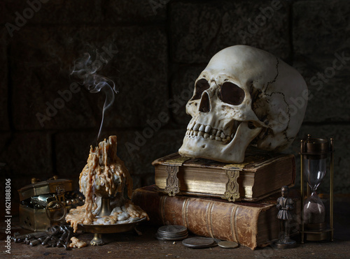 Still life with Extinguished Candle, Skull, and Antique Objects. 