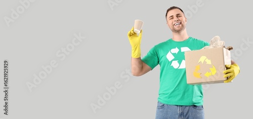 Male volunteer with recycli...