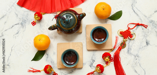 Fan with tangerines, cups o...