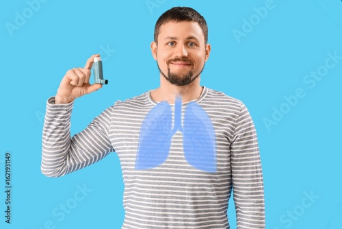 Young man with inhaler on b...