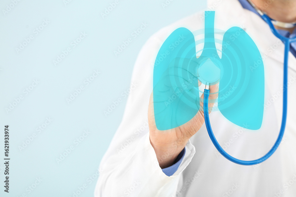 Naklejka premium Male doctor with stethoscope on light color background, closeup