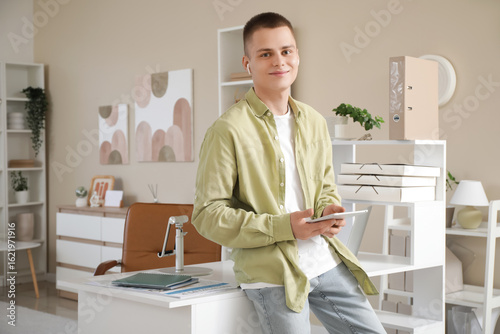 Young male freelancer with ...