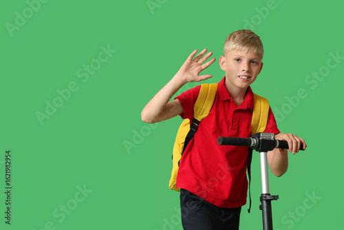 Cute schoolboy with modern ...