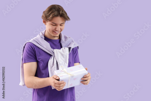 Handsome young man with gif...
