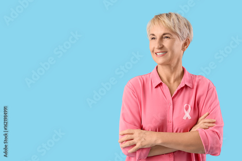 Mature woman with pink ribb...