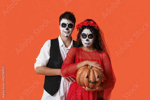 Young couple dressed for Ha...