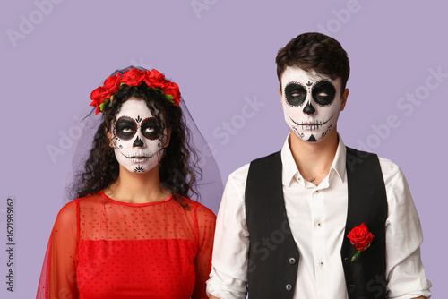 Young couple dressed for Ha...
