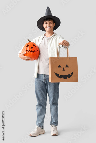 Young man in wizard hat wit...