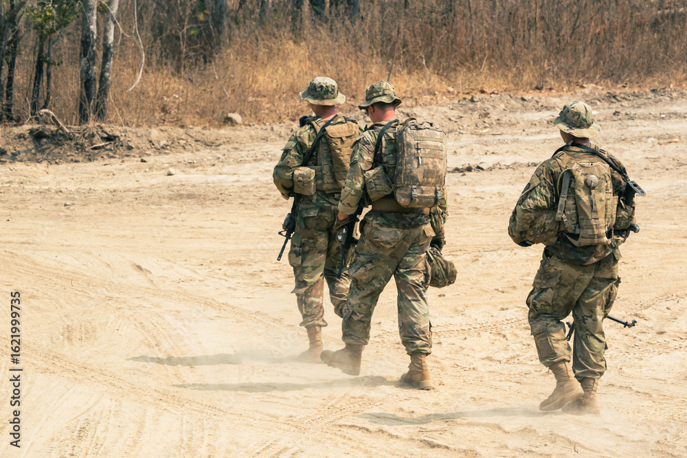 Fototapeta premium Backside of Soldier army operation, Military equipment, army helmet, warpaint, smoked dirty face