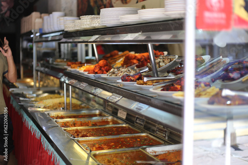 Photography Stainless Steel Trays with Food in Kuala Lumpur Street Café