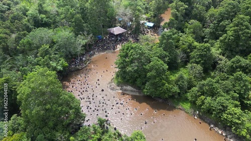 Traditional fishing by the Dayak tribe in East Barito, Central Kalimantan using a long spear called Tariuk