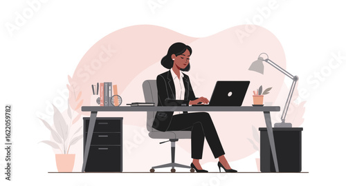 Businesswoman working on laptop at her desk, perfect for websites or marketing materials.