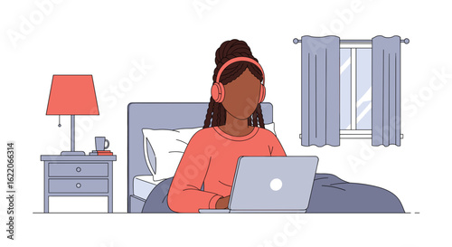 Woman working on laptop in bed, perfect for illustrating work from home, remote work, or online learning.