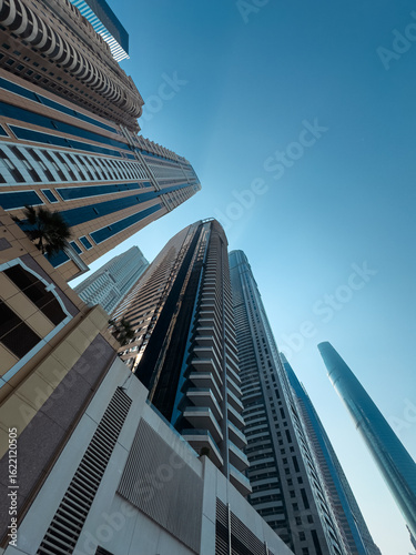 Canvas Print Huge super tall mega buildings in Dubai, tall super structures background, build