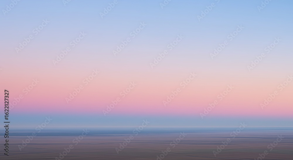 Obraz premium Pastel Sky Over Tranquil Landscape: Serene Pink and Blue Sunset Hues