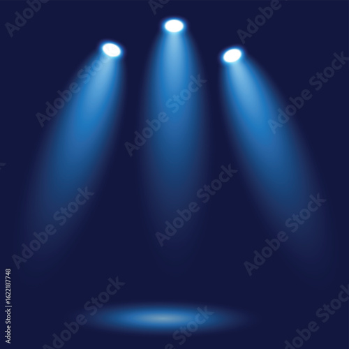 Blue spotlights illuminating an empty stage