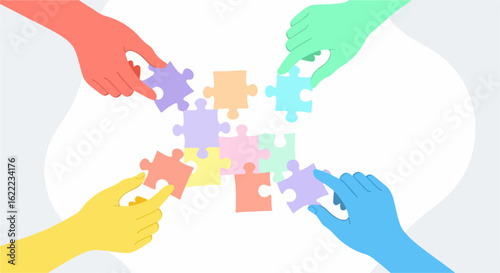 Colorful hands assembling puzzle pieces representing teamwork and collaboration