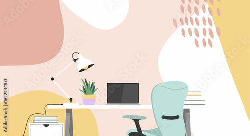 Office desk with lamp laptop and books