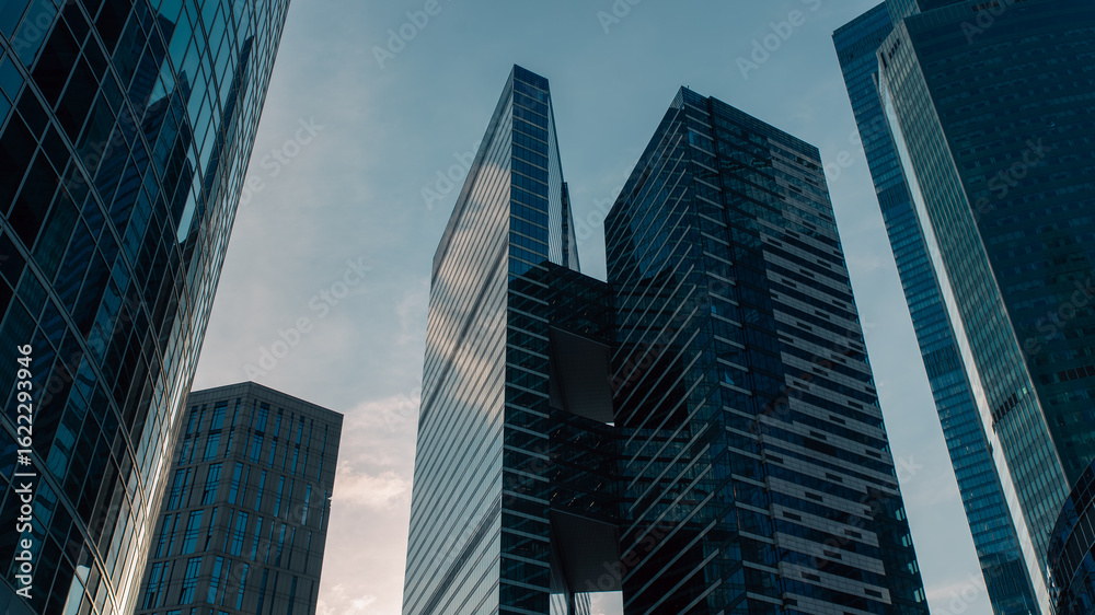 Obraz premium bottom view of the tall skyscrapers of the business district of a modern city