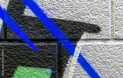 vivid street graffiti texture of colotful spray painting strips on gray metallic brick background, urban culture of modern youth backdrop