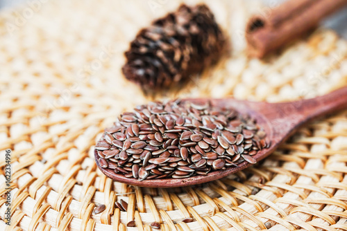 Close up of flaxseed on wooden spoon. Healthy food.