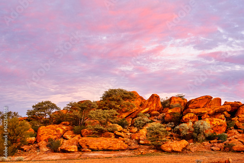 Colourful pink sky over red rocks at Peace Gorge free camp in Meekatharra, Western Australia