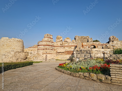 Schilderij op canvas Ancient ruins of Nessebar, weathered brick and stone walls remnants of Byzantine fortress structure