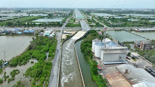 The Water Transfer Bridge serves as a crucial drainage channel, expediting water movement from canals to the sea and pumping it out to prevent floods and lessen flood impact. Thailand.
