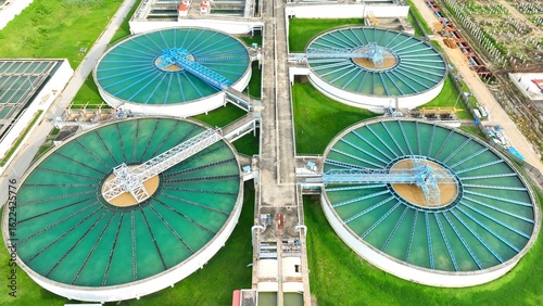 Aerial drone view of a wastewater treatment plant showing large clarifiers and filtration tanks, highlighting advanced infrastructure for sustainable water management and environmental protection.
