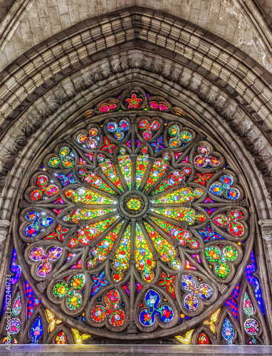 Interior of the Basilica of the National Vow in Neo Gothic style with its colorful stained glass windows.