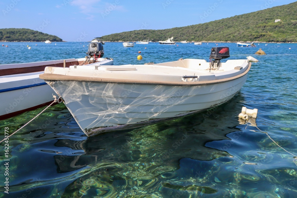 Fototapeta premium white boat in clear sea water