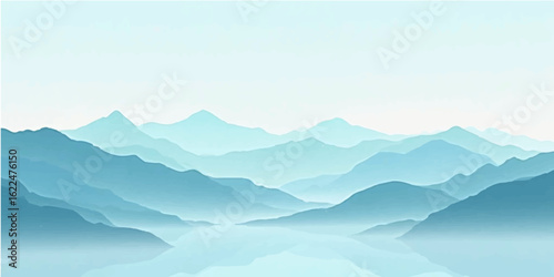 Misty mountain peaks in a winter landscape at sunrise with a blue sky