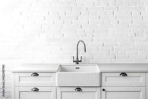 Modern white kitchen with marble countertop, white brick wall and white sink in a minimalist style.